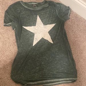 Dark green shirt with white star.
